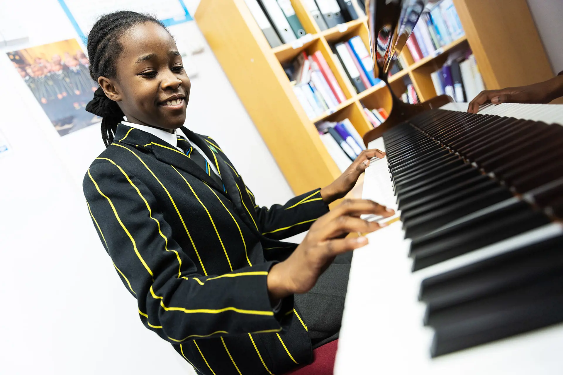 Prep School student playing piano in music lesson at The Ryleys School, a private school in Cheshire