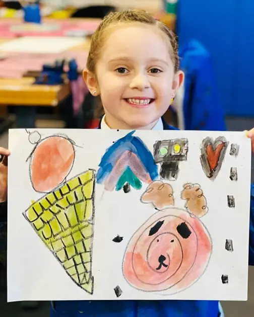 A pupil at The Ryleys School, a private school in Cheshire, showing their Kandinsky-inspired artwork