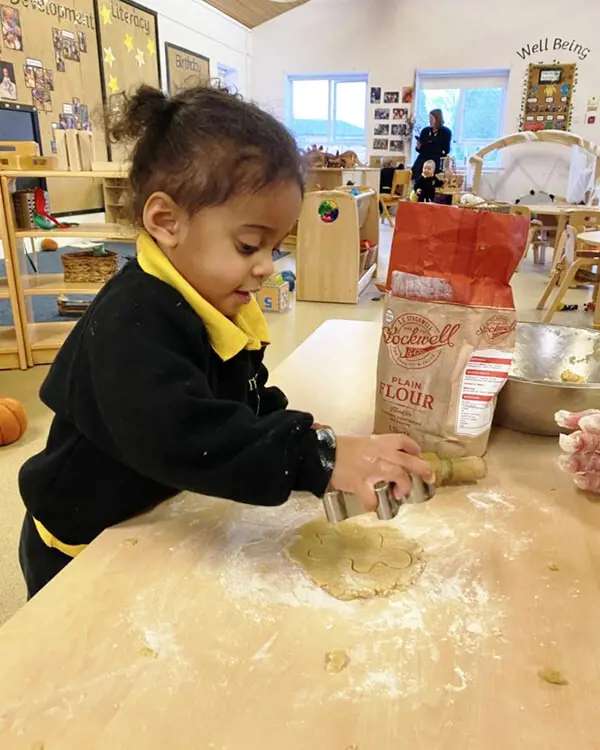 Pupils at Nursery at The Ryleys School, a private school in Cheshire, baking gingerbread men