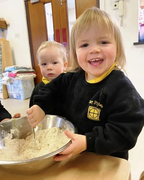 Pupils at Nursery at The Ryleys School, a private school in Cheshire, baking gingerbread men