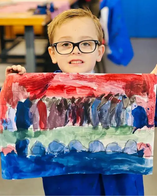 A pupil at The Ryleys School, a private school in Cheshire, showing their Kandinsky-inspired artwork