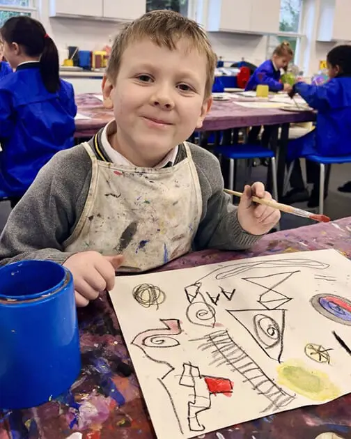 A pupil at The Ryleys School, a private school in Cheshire, showing their Kandinsky-inspired artwork