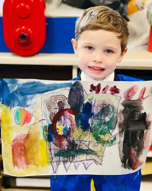 A pupil at The Ryleys School, a private school in Cheshire, showing their Kandinsky-inspired artwork