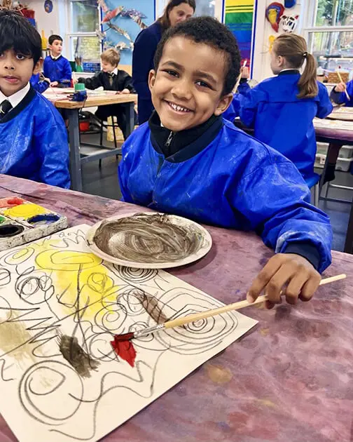 A pupil at The Ryleys School, a private school in Cheshire, showing their Kandinsky-inspired artwork