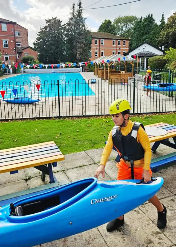 Pupils swimming and enjoying the pool at The Ryleys School, a private prep school in Alderley Edge, Cheshire